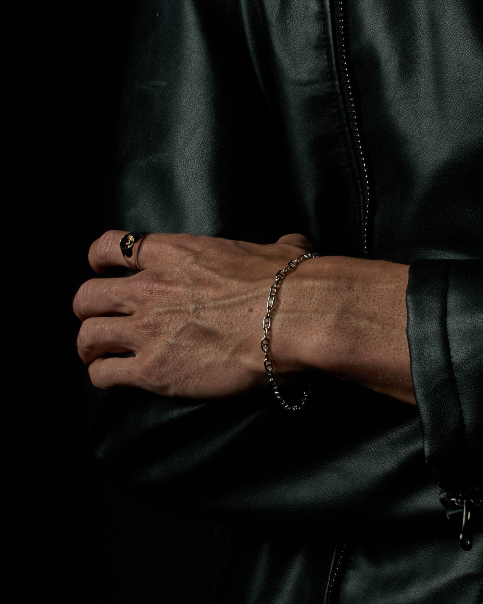 Infinite bracelet worn on a model's wrist