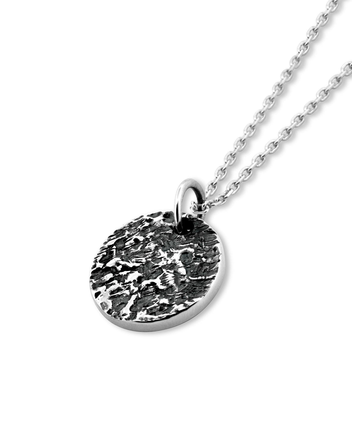 Martinez Pendant handcrafted from solid 925 sterling silver featuring an organic textured disc design.