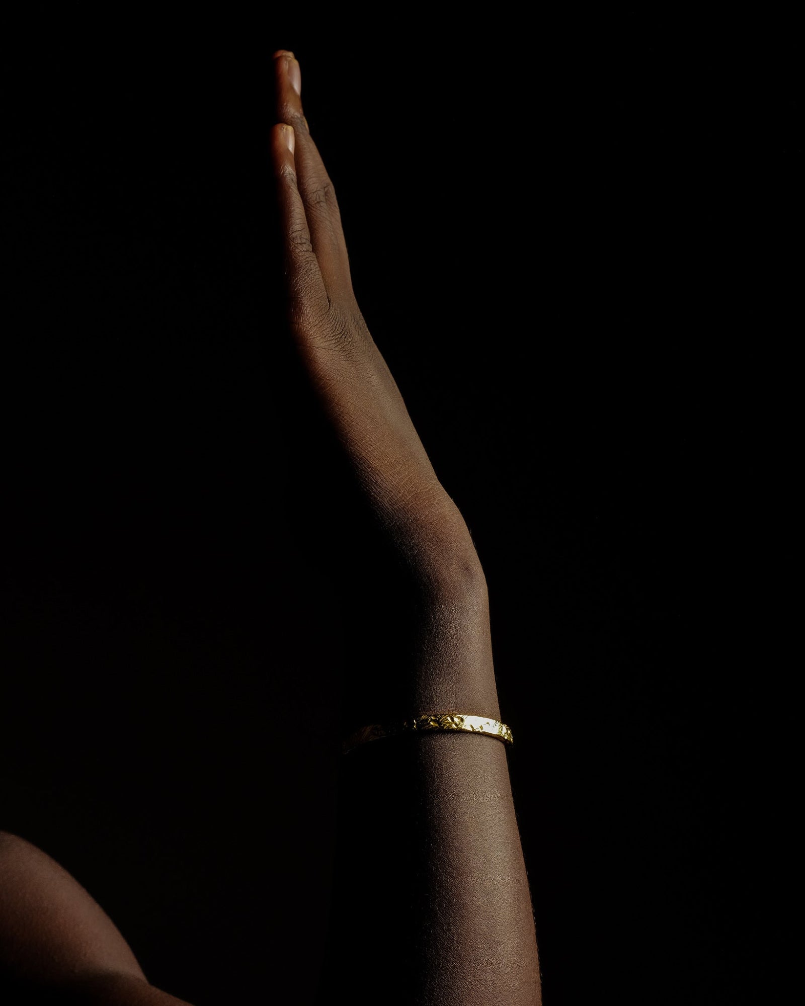 Mickey cuff bracelet worn on a model's wrist
