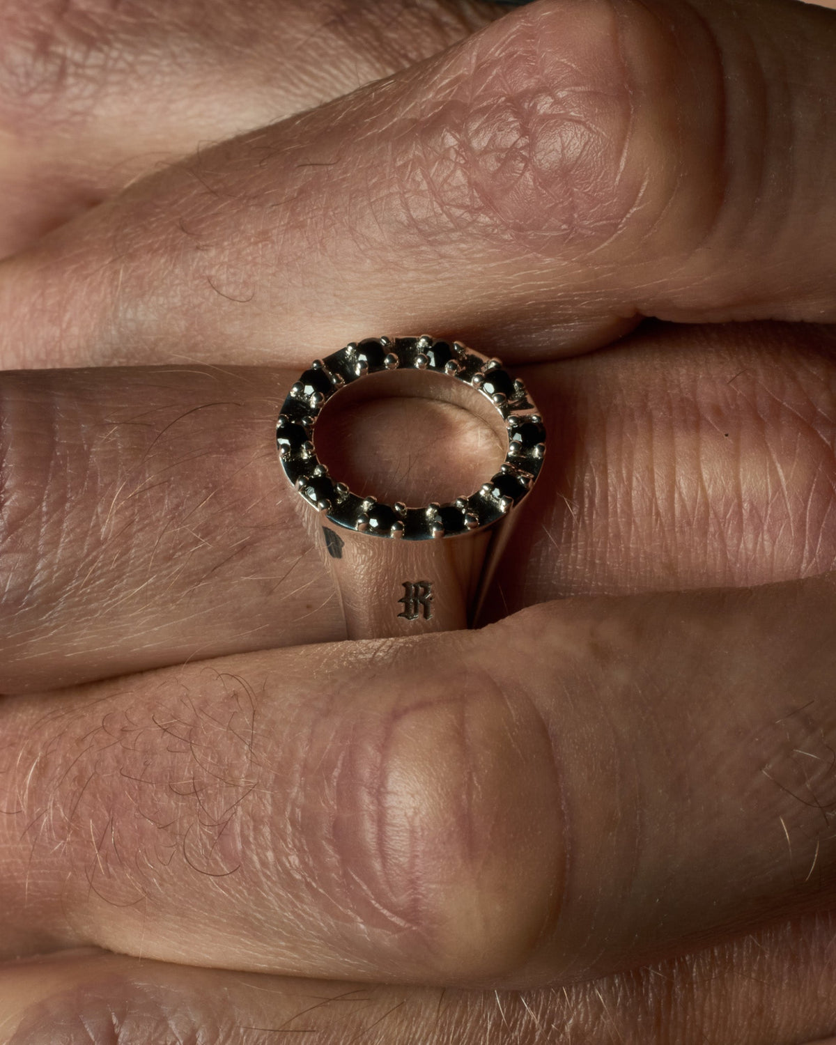 Close-up of the Octavia ring's black onyx stones