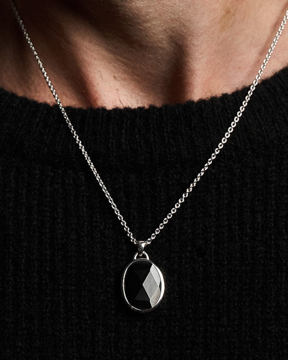 Model wearing the Suki Black Onyx Pendant handcrafted from solid 925 sterling silver on a sterling silver necklace.