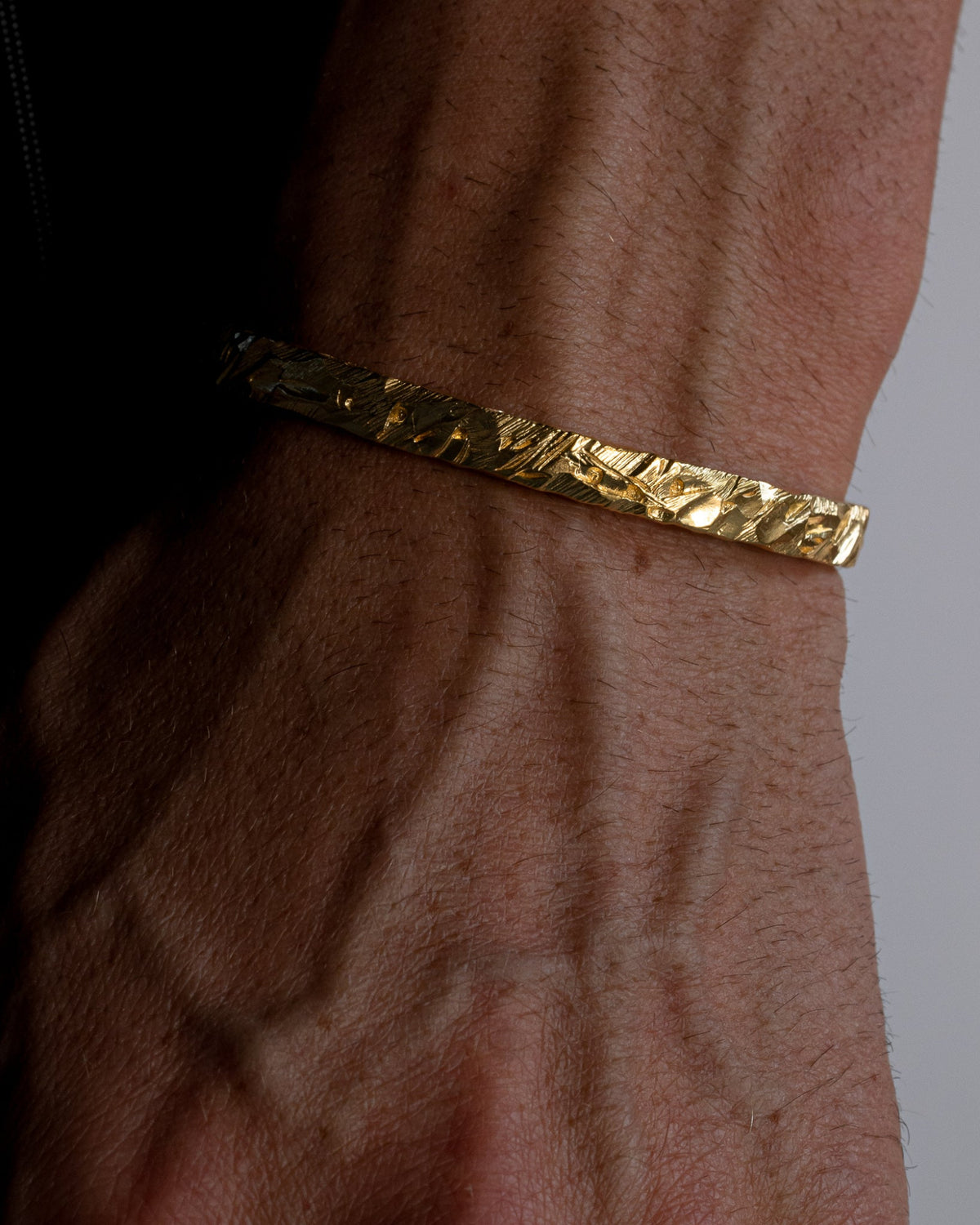 asper cuff bracelet worn on a model's wrist 1