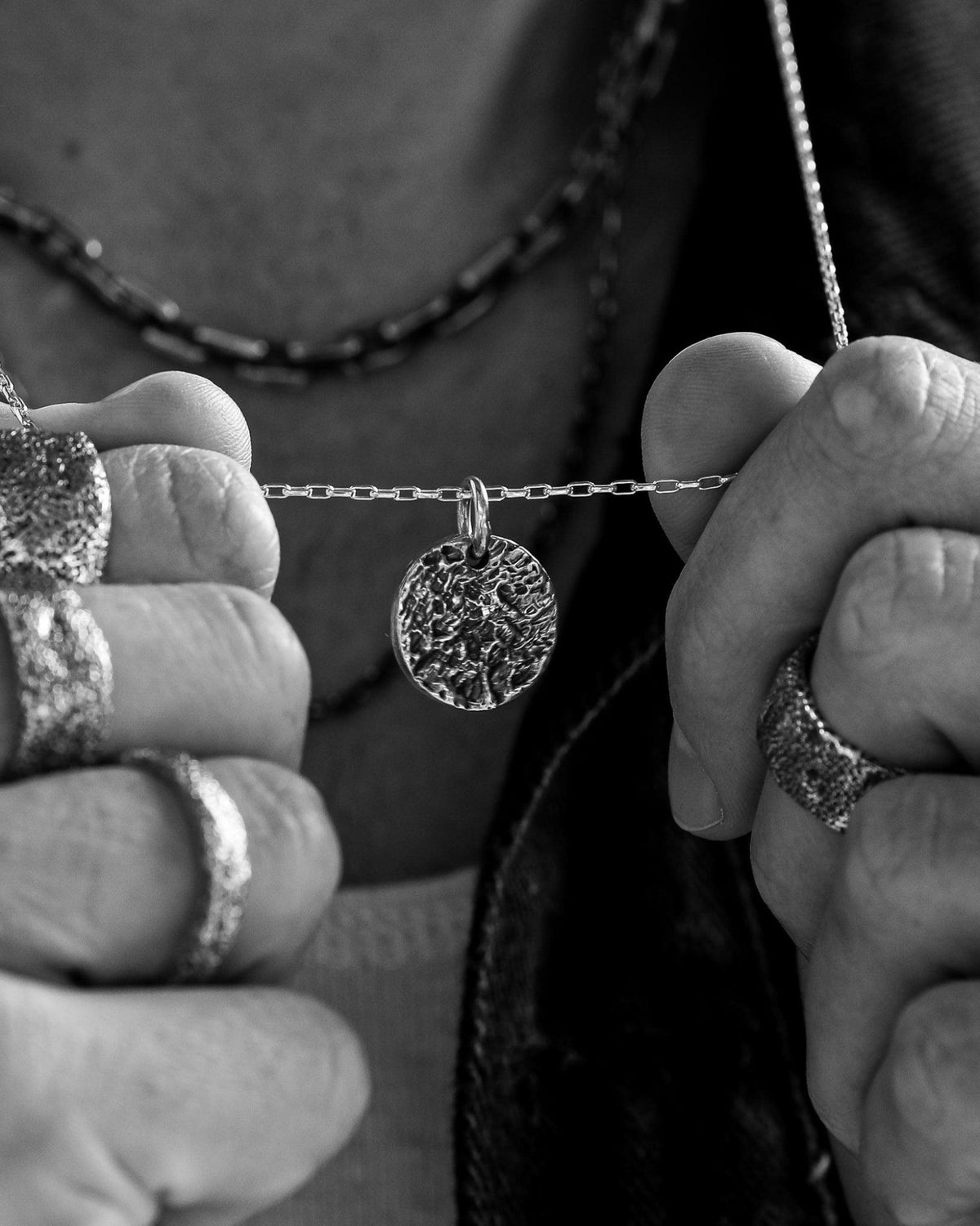 Close-up of the Martinez Pendant handcrafted from solid 925 sterling silver with an organic textured finish.